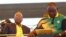 FILE - Newly-elected ruling African National Congress (ANC) party president, Cyril Ramaphosa, right, and former ANC president and South African President Jacob Zuma, left, attend the party's 106th birthday celebrations in East London, South Africa, Jan. 13, 2018.