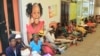 FILE: Women queue at bank to withdraw money before Zimbabwe introduces new local currency, Harare, Oct. 28, 2016.