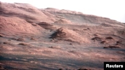FILE - The base of Mars' Mount Sharp is pictured in this August 27, 2012 NASA handout photo taken by the Curiosity rover. 