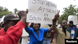 Zimbabweans rally against recent anti-immigrant violence in South Africa, outside the South African embassy in Harare, April 17, 2015.