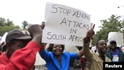 Zimbabweans rally against recent anti-immigrant violence in South Africa, outside the South African embassy in Harare, April 17, 2015.