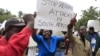 Zimbabweans rally against recent anti-immigrant violence in South Africa, outside the South African embassy in Harare, April 17, 2015.