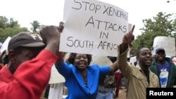 Zimbabweans rally against recent anti-immigrant violence in South Africa, outside the South African embassy in Harare, April 17, 2015.