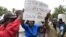 Zimbabweans rally against recent anti-immigrant violence in South Africa, outside the South African embassy in Harare, April 17, 2015.
