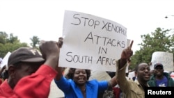 Zimbabweans rally against recent anti-immigrant violence in South Africa, outside the South African embassy in Harare, April 17, 2015.