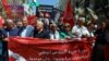 FILE— Protest demanding the release of imprisoned journalists, activists, opposition figures and setting a date for fair presidential elections in Tunis, Tunisia May 12, 2024.