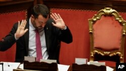 FILE - Italian Deputy Premier and Interior Minister, Matteo Salvini, gestures as he addresses the Senate in Rome, July 11, 2019.