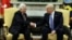 FILE - President Donald Trump shakes hands with with Palestinian leader Mahmoud Abbas during their meeting in the Oval Office of the White House, May 3, 2017, in Washington. 