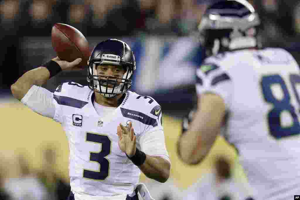 Seattle Seahawks' Russell Wilson looks to pass against the Denver Broncos during the first half of the NFL Super Bowl XLVIII football game, Feb. 2, 2014, in East Rutherford, N.J.