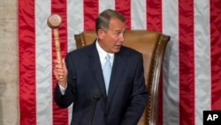 U.S. Representative John Boehner of Ohio holds the gavel after being re-elected to a third term as House speaker during the opening session of the 114th Congress in Washington, Jan. 6, 2015.