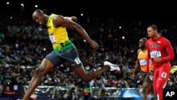August 5, 2012: Jamaica's Usain Bolt crosses the finish line to win gold in the men's 100-meter final during the 2012 Summer Olympics in London. 