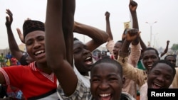 Supporters of the presidential candidate Muhammadu Buhari and his All Progressive Congress (APC) party celebrate in Kano, March 31, 2015. 