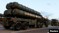 FILE - Russian S-400 air defense mobile missile launching systems are seen in Minsk, July 3, 2014. 