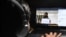 A boy watches "I For India" concert live on Facebook during a government-imposed nationwide lockdown as a preventive measure against the COVID-19 coronavirus, in Ghaziabad on May 3, 2020.