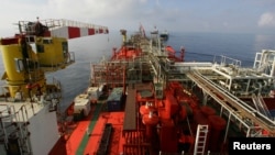 FILE - The deck of Bluewater's floating production, storage and offloading vessel Munin, which floats on the Lufeng oil field, 250 kilometers south-east of Hong Kong in the South China Sea.
