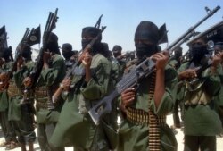 FILE - Islamist fighters loyal to Somalia’s al-Qaida-inspired al-Shabab group perform military drills at a village in Lower Shabelle region, some 25 kilometers outside Mogadishu, Feb. 17, 2011.