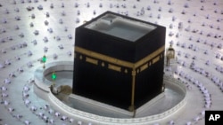 Muslims pray during the first dawn prayers of the Islamic holy month of Ramadan, around the Kaaba, the cubic building at the Grand Mosque. (AP Photo/Amr Nabil)