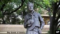 In this Wednesday, Feb. 12, 2020, photo, a statue stands outside the Boys Scouts of America headquarters in Irving, Texas. The Boy Scouts of America has filed for bankruptcy protection as it faces many of new sex-abuse lawsuits. (AP Photo/LM Otero)