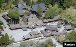 Romon gate (bottom R), designated as a nationally important cultural property, and other buildings damaged by an earthquake are seen at Aso Shrine in Aso, Kumamoto prefecture, southern Japan, in this photo taken by Kyodo, April 16, 2016.