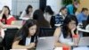FILE - Students are seen completing an exercise at a Girls Who Code class in San Jose, California, June 18, 2014. Girls Who Code, a national non-profit, aims to prepare young women for futures in computing-related fields. 