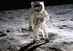 FILE - Astronaut Buzz Aldrin walks on the surface of the moon in this photo taken by Neil Armstrong.