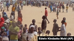 FILE - Refugees that fled their homes due to violence from the Islamic extremists group Boko Haram inside a refugee camp in Minawao, Cameroon, Feb. 25, 2015.