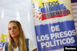 Lilian Tintori, wife of jailed Venezuelan opposition leader Leopoldo Lopez, attends a news conference at the office of the party Popular Will (Voluntad Popular) in Caracas, Venezuela, Jan. 18, 2017. The text reads, "All for the freedom of political prisoners."