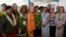 U.S. Secretary of State Hillary Rodham Clinton, center, poses with female participants of the "Dialogue on Gender Equality" in Rarotonga, Cook Islands, Aug. 31, 2012. 