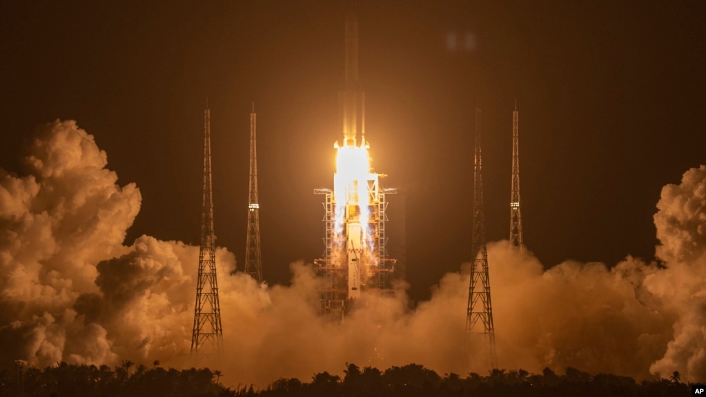 In this Nov. 24, 2020, file photo, a Long March-5 rocket carrying the Chang'e 5 lunar mission lifts off at the Wenchang Space Launch Center in Wenchang in southern China's Hainan Province. (AP Photo/Mark Schiefelbein, File)