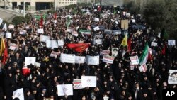 Iranian protesters chant slogans at a rally in Tehran, Iran, Dec. 30, 2017. Iranian hard-liners rallied Saturday to support the country's supreme leader and clerically overseen government as spontaneous protests sparked by anger over the country's ailing 