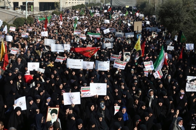 FILE - Iranian protesters chant slogans at a rally in Tehran, Dec. 30, 2017.