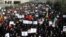 Iranian protesters chant slogans at a rally in Tehran, Iran, Dec. 30, 2017. Iranian hard-liners rallied Saturday to support the country's supreme leader and clerically overseen government as spontaneous protests sparked by anger over the country's ailing 