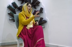 FILE - Fawzia Koofi, chair of the Women, Civil Society and Human Rights Commission, speaks in an interview in Kabul, Feb. 18, 2019. Taliban militants threatened to kill her when she became an MP and a women's rights champion.