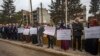 FILE - Protesters demonstrate outside a U.N. building, in the northeast city of Qamishli, Nov. 28, 2021. Numerous journalists covering a demonstration on Dec. 7, 2021, were temporarily detained.