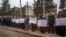 FILE - Protesters demonstrate outside a U.N. building, in the northeast city of Qamishli, Nov. 28, 2021. Numerous journalists covering a demonstration on Dec. 7, 2021, were temporarily detained.