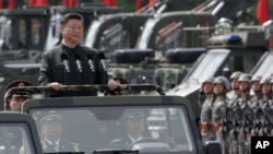 Chinese President Xi Jinping inspects Chinese troops of People's Liberation Army (PLA) Hong Kong Garrison at the Shek Kong Barracks in Hong Kong, June 30, 2017. 