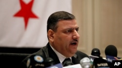 Riad Hijab, Syria’s defected former prime minister, speaks at a press conference at the Hyatt Hotel in Amman, Jordan, August 14, 2012. 