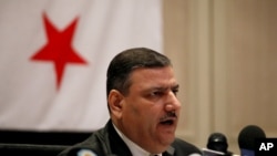 Riad Hijab, Syria’s defected former prime minister, speaks at a press conference at the Hyatt Hotel in Amman, Jordan, August 14, 2012.
