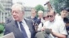 FILE - Former U.S. President Jimmy Carter leaves the White House, June 19, 1994, in Washington after he briefed top administration officials on his recent trip to North Korea.