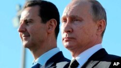 Tổng thống Nga Putin (phải) là đồng minh thân cận của ông Bashar al-Assad 