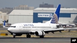 FILE - United Airlines passenger plane lands at Newark Liberty International Airport in Newark, N.J. 
