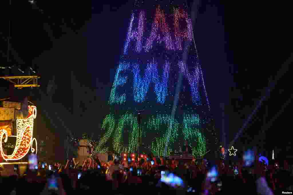 People attend New Year’s Eve celebrations in Mumbai, India, Dec. 31, 2024. 