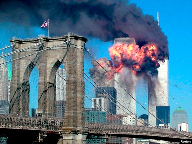 The second tower of the World Trade Center bursts into flames after being hit by a hijacked airplane in New York in this September 11, 2001 file photograph. (REUTERS/Sara K. Schwittek/Files)