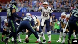 New England Patriots quarterback Tom Brady (12) calls a play against the Seattle Seahawks during the first half of NFL Super Bowl XLIX football game Feb. 1, 2015, in Glendale, Arizona.