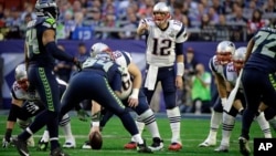 New England Patriots quarterback Tom Brady (12) calls a play against the Seattle Seahawks during the first half of NFL Super Bowl XLIX football game Feb. 1, 2015, in Glendale, Arizona.