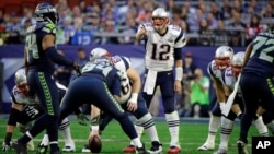 New England Patriots quarterback Tom Brady (12) calls a play against the Seattle Seahawks during the first half of NFL Super Bowl XLIX football game Feb. 1, 2015, in Glendale, Arizona.