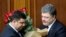 FILE - Ukraine's President Petro Poroshenko, right, and Volodymyr Groysman celebrate after Groysman was appointed prime minister during a parliament session in Kyiv, Ukraine, April 14, 2016, after lawmakers endorsed Arseniy Yatsenyuk’s resignation.