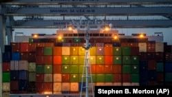 FILE: Ship to shore cranes work the container ship CMA CGM Laperouse at the Georgia Ports Authority's Port of Savannah, Wednesday, Sept. 29, 2021, in Savannah, Ga.