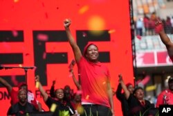 FILE - EFF leader Julius Malema gestures at the party's manifesto launch at Moses Mabhida Stadium in KwaZulu Natal province, South Africa, Feburary 10, 2024.