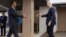 U.N. Special Envoy for Syria Staffan de Mistura, right, prepares to shake hands with Syria's main opposition High Negotiations Committee leader Nasr al-Hariri upon his arrival for a meeting during Syria peace talks in Geneva, Switzerland, Feb. 27, 2017.